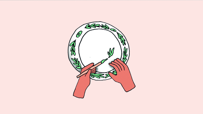 Illustration représentant une main en train de peindre sur une assiette