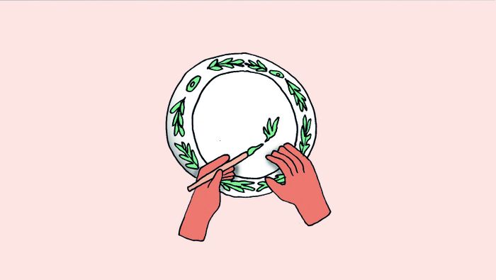 Illustration représentant une main en train de peindre sur une assiette