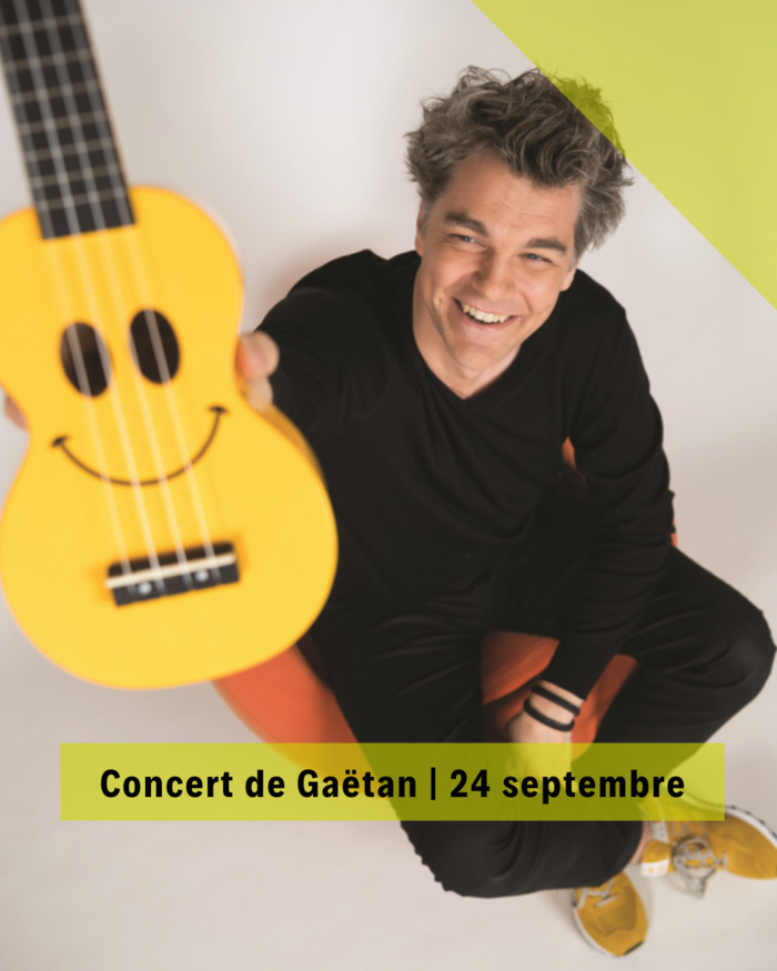 DR Gaëtan une guitare à la main
