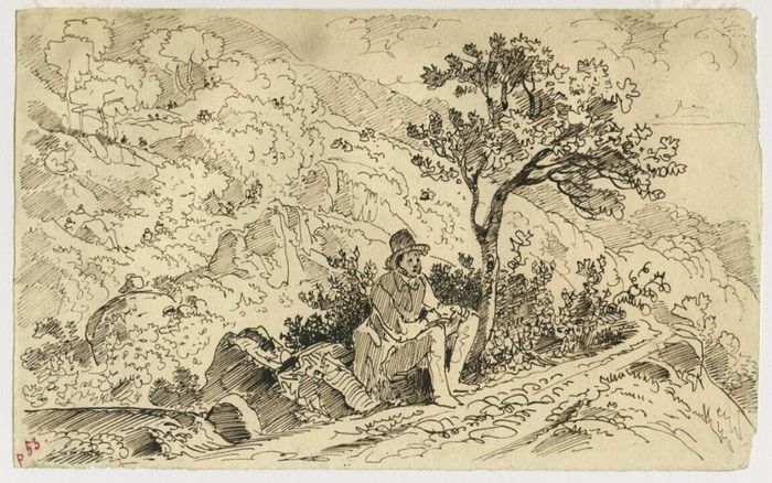 Homme assis sous un arbre sur un chemin de montagne