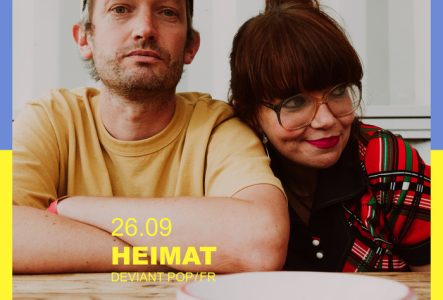 Affiche en couleurs du concert de Heimat avec un portrait du groupe et la mention de la date, le 26 septembre 2025.