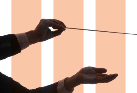 Affiche avec la main d'un chef d'orchestre