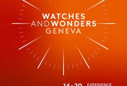 C'est l'affiche pour l'événement "Watches and Wonders". Le fond est de couleur orange dégradé, avec un motif de rayons évoquant un cadran d'horloge. L'image montre aussi un paysage de Genève avec la célèbre fontaine Jet d'Eau en arrière-plan.